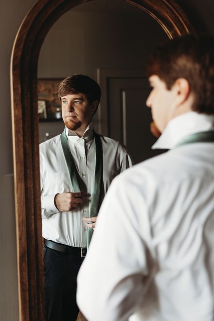 Groom getting ready with a groomsman