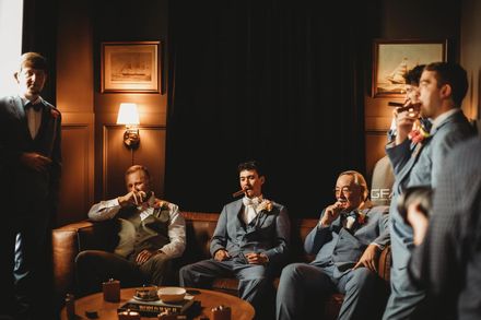 Groomsmen relaxing in the suite