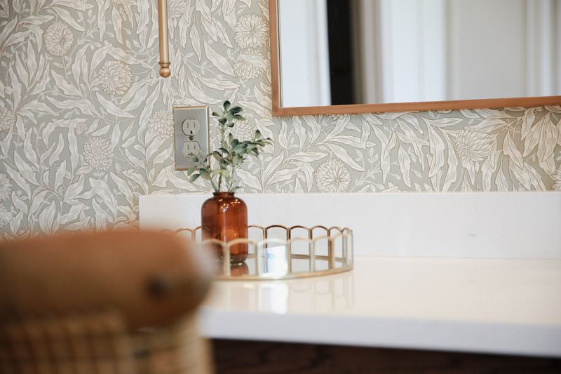 Powder room vanity with patterned wallpaper